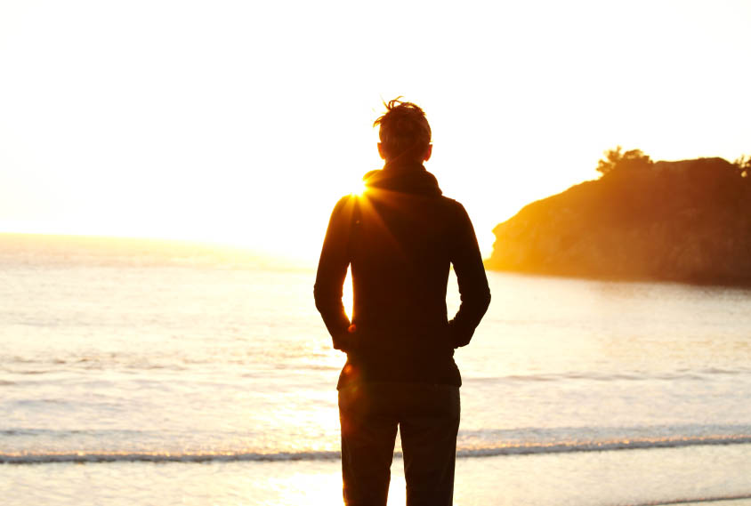 Young woman looking at sunset