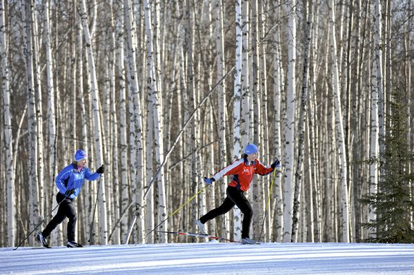 Friends enjoy nordic skiing on the Jim Whisenhant Cross Country Ski Trail system at Birch Hill Recreation Area in Fairbanks Alaska March 2011.