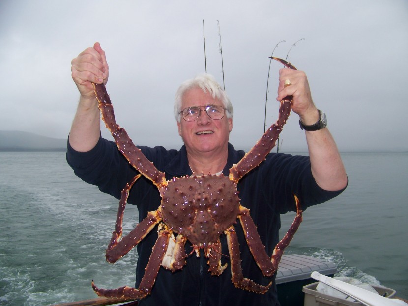 Man holding up King Crab