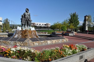 Statue of Alaska Natives with Flowers on sunny day in downtown Fairbanks, Alaska - Princess Lodges