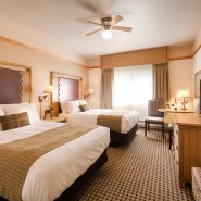 2 queen beds in a guest room at Mt. McKinley Princess Wilderness Lodge